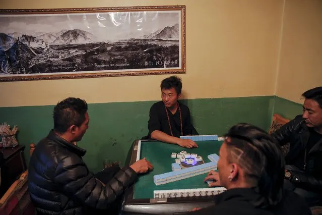 People play mahjong inside a shop in the old part of Lhasa, Tibet Autonomous Region, China November 16, 2015. (Photo by Damir Sagolj/Reuters)