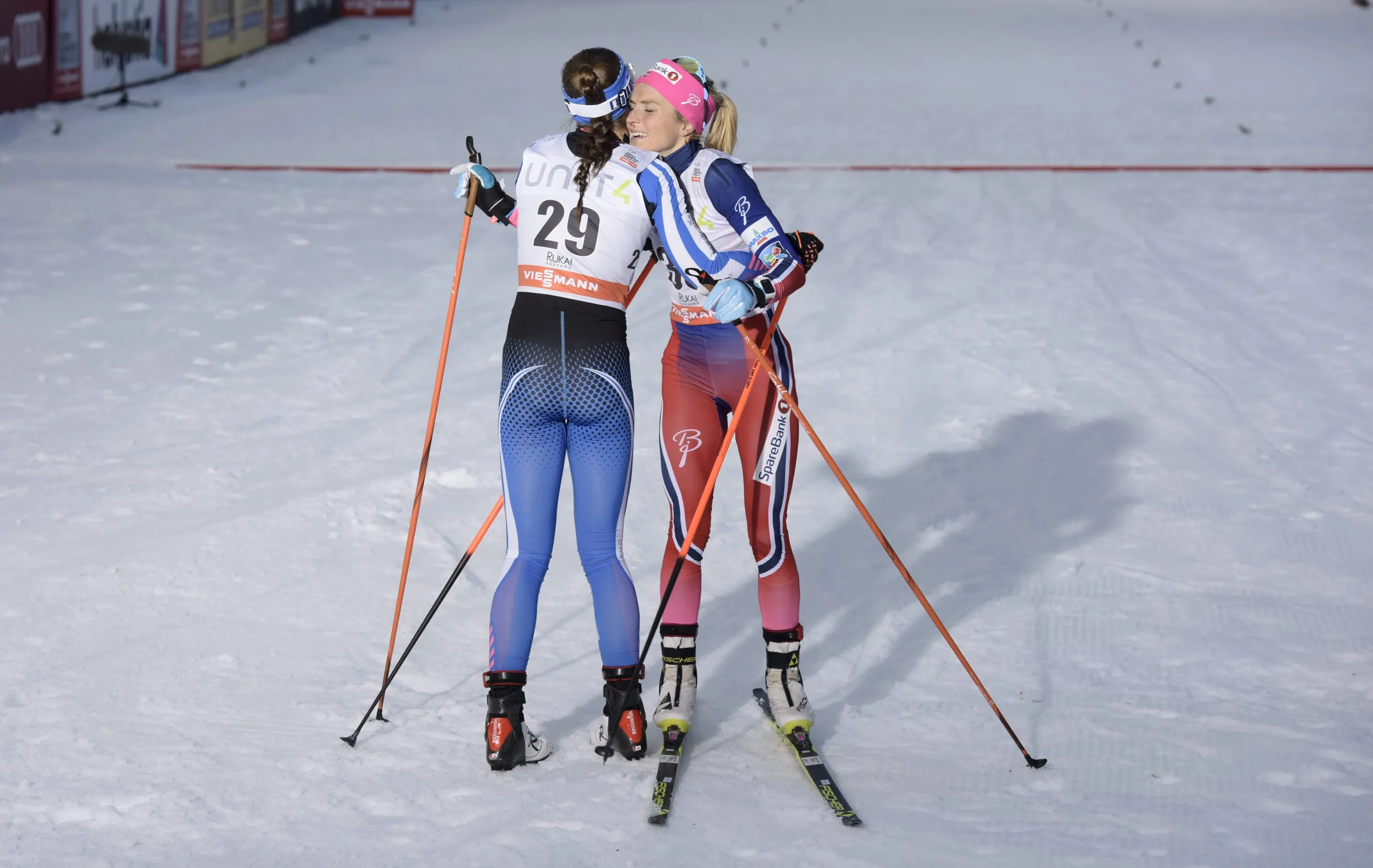 Next picture →. Winner Therese Johaug (R) of Norway is congratulated by