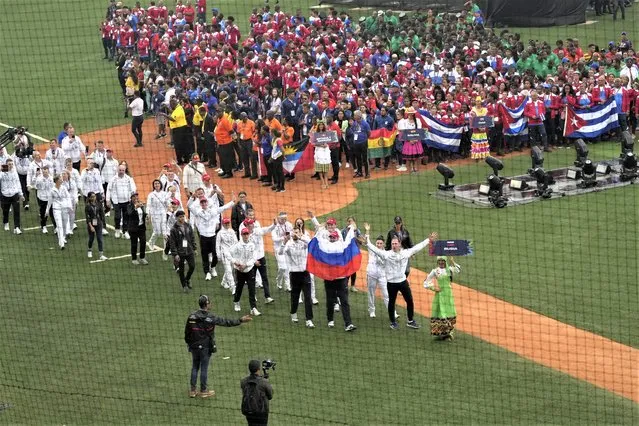Russian athletes parade in the Alba Games' opening ceremony at the baseball stadium in La Guaira, Venezuela, Friday, April 21, 2023. (Photo by Ariana Cubillos/AP Photo)