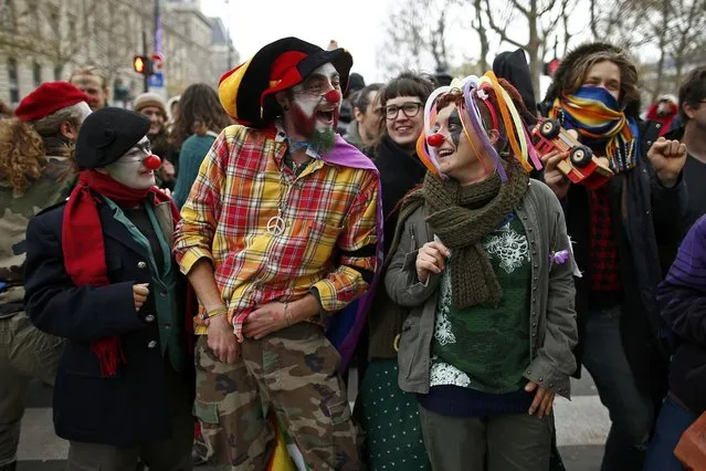 Environmentalists gather during a protest near the Place de la Republique after the cancellation of a planned climate march following shootings in the French capital, ahead of the World Climate Change Conference 2015 (COP21), in Paris, France, November 29, 2015. (Photo by Benoit Tessier/Reuters)