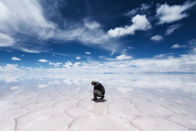“Alone”. I felt the beautiful landscape of the Earth. Location: Salara de Uyuni, Bolivia. (Photo and caption by Takaki Watanabe/National Geographic Traveler Photo Contest)