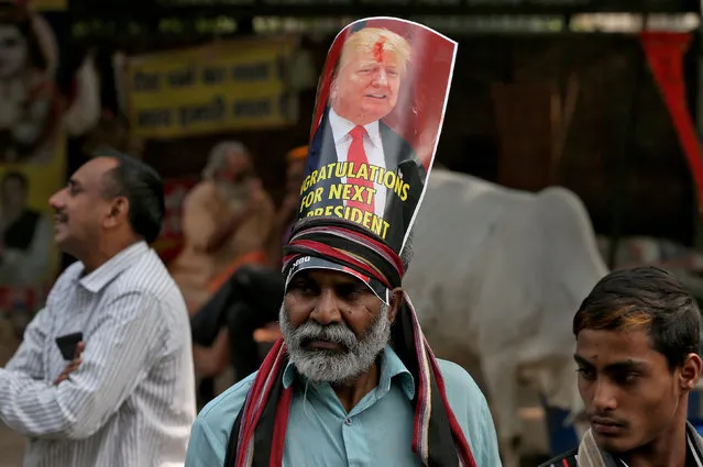 A members of Hindu Sena, a right-wing Hindu group, celebrate Republican presidential nominee Donald Trump's victory in the U.S. elections, in New Delhi, India, November 9, 2016. (Photo by Cathal McNaughton/Reuters)