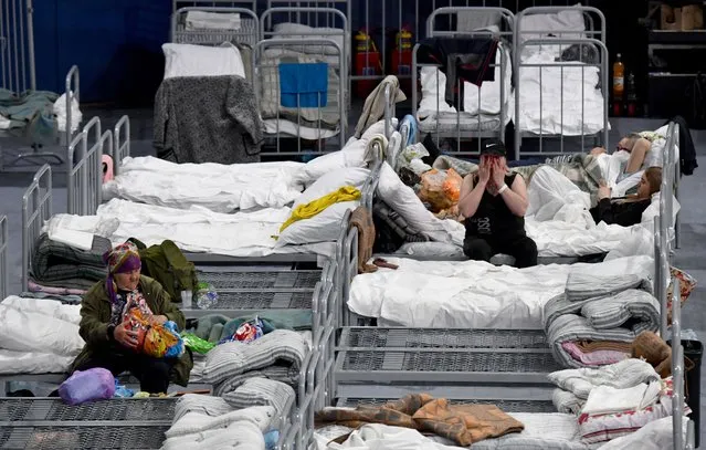 Residents evacuated from the Belgorod region's zones bordering Ukraine, including those from the town of Shebekino, are seen settled in a temporary shelter set up at the Belgorod Arena in the regional capital of Belgorod on June 2, 2023. (Photo by Olga Maltseva/AFP Photo)