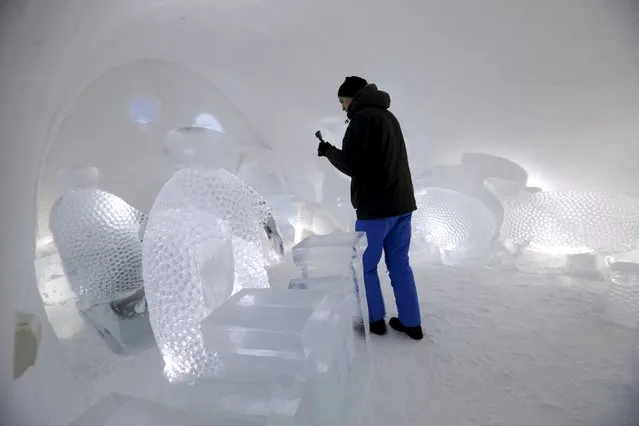 A man takes a picture of a room in the Ice hotel in Jukkasjarvi, Sweden, December 16, 2015. (Photo by Ints Kalnins/Reuters)