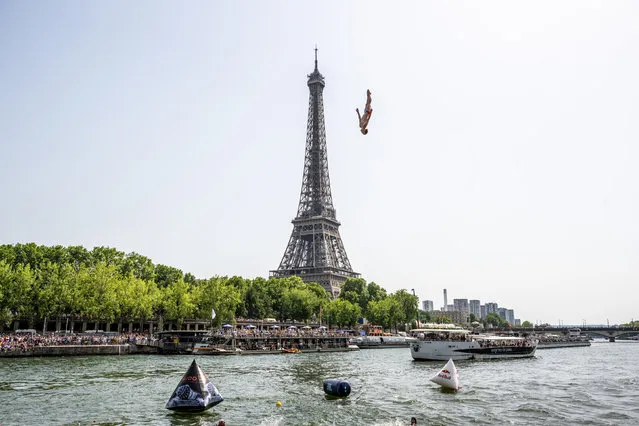 In this handout image provided by Red Bull, Gary Hunt of France dives from the 27.5 metre platform during the final competition day of the second stop of the Red Bull Cliff Diving World Series on June 18, 2022 at Paris, France. (Photo by Romina Amato/Red Bull via Getty Images)