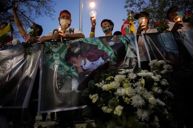 People gather to mourn those who died in Myanmar during anti-coup protests, in front of the U.N. building in Bangkok, Thailand on March 4, 2021. (Photo by Athit Perawongmetha/Reuters)