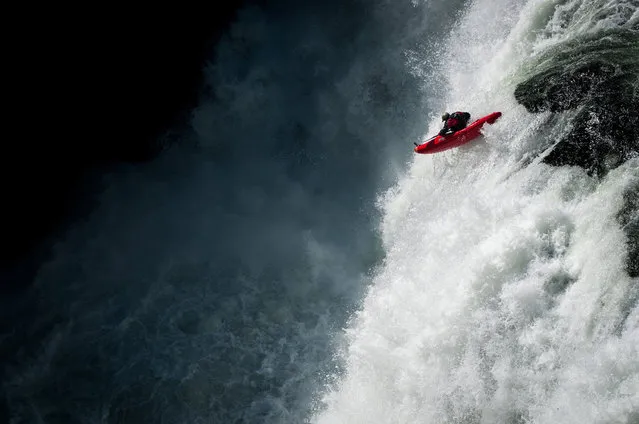 Photographer: David Carlier. Athlete: Gary Edgeworth. Location: Lower Mesa Falls, Idaho. (Photo by David Carlier/Red Bull Illume via The Atlantic)