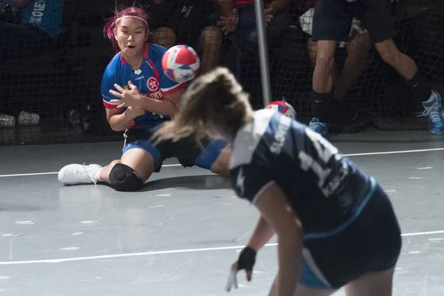 A Hong Kong player is hit by the ball during women's competition against Slovenia in the Dodgeball World Cup, Saturday, Aug. 4, 2018, in New York. (Photo by Mary Altaffer/AP Photo)