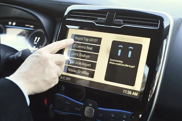 Nissan Motor Co. General Manager Tetsuya Iijima selects a destination while configuring a Nissan Leaf's autonomous drive mode in Sunnyvale, California January 7, 2016. (Photo by Noah Berger/Reuters)