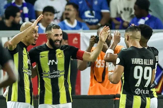 Ittihad's French forward #09 Karim Benzema (2nd-L) celebrates after a goal during the Saudi Pro League football match between Al-Ittihad and Al-Nassr at Prince Abdullah al-Faisal Stadium in Jeddah on September 1, 2023. (Photo by AFP Photo/Stringer)