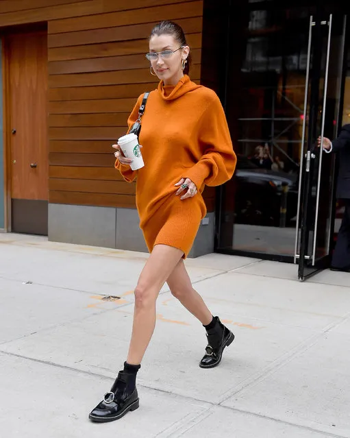Bella Hadid wears a orange sweaterdress in New York City on October 8, 2018. (Photo by Robert O'neil/Splash News and Pictures)