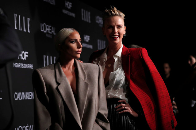 Honorees Lady Gaga and actor Charlize Theron pose at the 25th annual ELLE Women in Hollywood in Los Angeles on October 16, 2018. (Photo by Mario Anzuoni/Reuters)