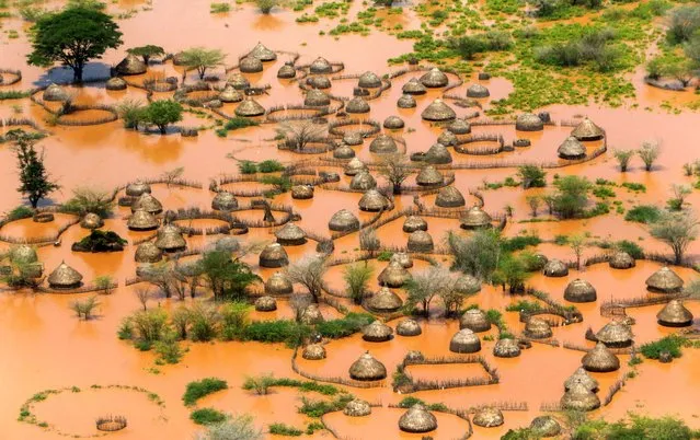 An aerial view shows a deserted and flooded traditional homestead following heavy rains in Garsen, Tana Delta within Tana River county, Kenya on November 23, 2023. (Photo by Thomas Mukoya/Reuters)