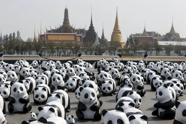 Panda sculptures are seen in front of Grand Palace during an exhibition by French artist Paulo Grangeon in Bangkok, Thailand, March 4, 2016. (Photo by Chaiwat Subprasom/Reuters)