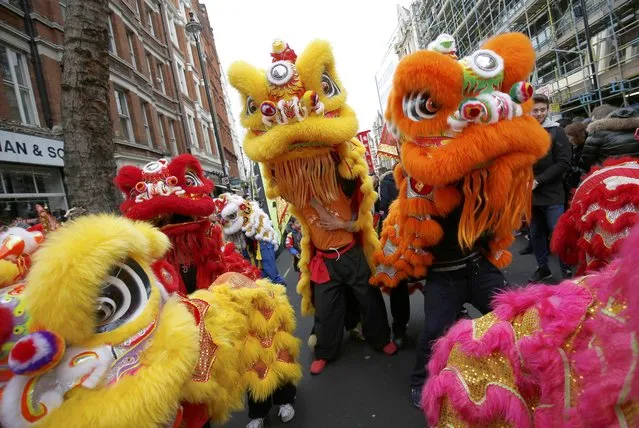 Participants wear costume as they take part in an event to celebrate the Chinese Lunar New Year of the Rooster in London, Britain, January 29, 2017. (Photo by Neil Hall/Reuters)