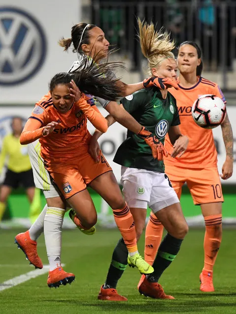 Olympique Lyonnais' Selma Bacha and Sarah Bouhaddi in action with VfL Wolfsburg's Pernille Harder during the UEFA women's Champions League quarter-final, second-leg football match between Vfl Wolfsburg and Olympique Lyonnais in Wolfsburg, western Germany on March 27, 2019. (Photo by Fabian Bimmer/Reuters)