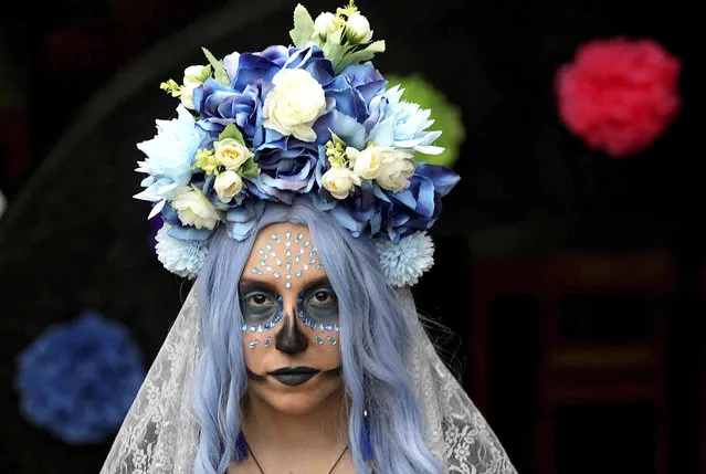 Angelika Garza wears her attire during PSJA Memorial Early College Dia de Muertos Annual Showcase on Monday, November 1,2021 in Alamo, Texas. (Photo by Delcia Lopez/The Monitor via AP Photo)