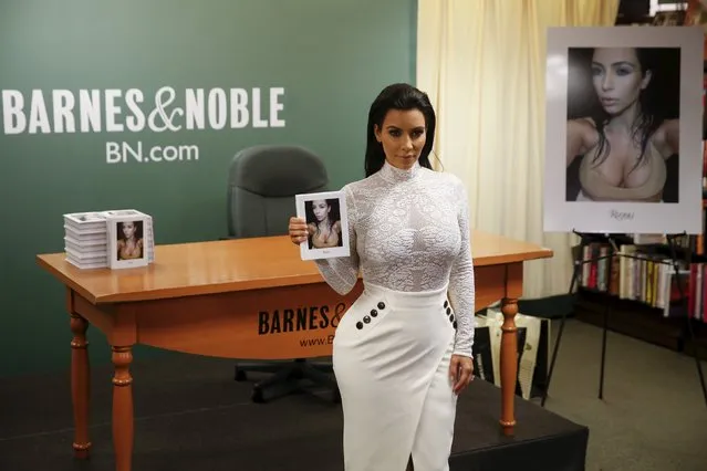 Kim Kardashian poses with her book “Selfish” before a book signing at Barnes & Noble in New York May 5, 2015. (Photo by Shannon Stapleton/Reuters)