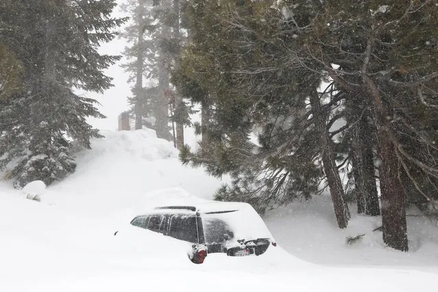 A car is covered with snow in Mammoth Lakes, California, USA, 01 March 2024. The National Weather Service (NWS) issued a blizzard warning for Mono County until 03 March. The NWS expects winds gusting as high as 70 miles per hour in the lower elevations and above 100 miles per hour over the Sierra ridges. (Photo by Caroline Brehman/EPA/EFE/Rex Features/Shutterstock)