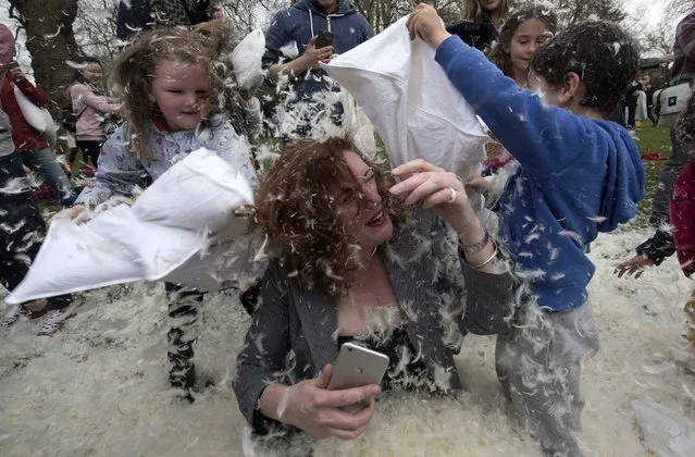 Members of the public take part in International Pillow Fight Day event on Kennington Park in London, Britain, 02 April 2016. (Photo by Will Oliver/EPA)