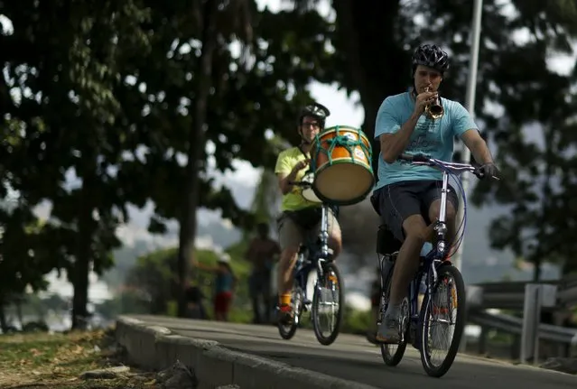 Members of the Cyclophonica band play instruments during a ride in Rio de Janeiro May 17, 2015. (Photo by Pilar Olivares/Reuters)