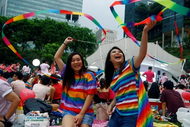 Participants of Pink Dot, an annual event organised in support of the LGBT community, pose for a photo at the Speakers' Corner in Hong Lim Park in Singapore, June 29, 2019. (Photo by Feline Lim/Reuters)