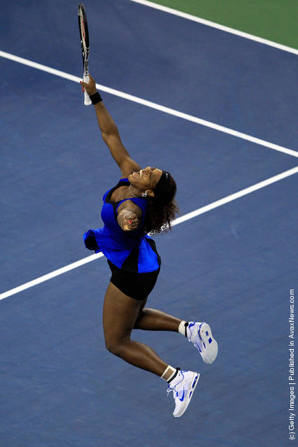 Serena Williams of the United States celebrates after she won match point against Caroline Wozniacki of Denmark