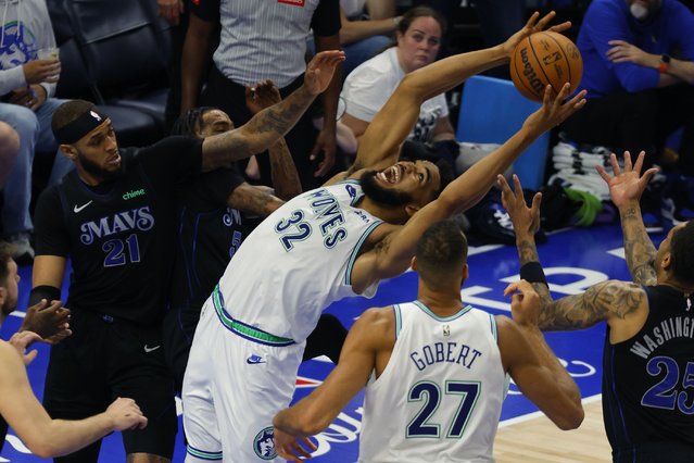 Minnesota Timberwolves center Karl-Anthony Towns (32) is fouled by Dallas Mavericks forward Derrick Jones Jr., third from left, during the second half of Game 2 of the NBA basketball Western Conference finals, Friday, May 24, 2024, in Minneapolis. (Photo by Bruce Kluckhohn/AP Photo)