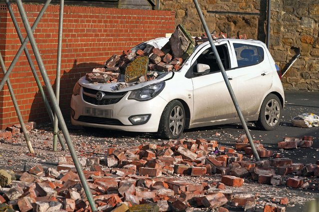 A car crushed by fallen bricks in Seaton Sluice, Northumberland after strong winds from Storm Malik battered northern parts of the UK on Sunday, January 30, 2022. (Photo by Owen Humphreys/PA Images via Getty Images)