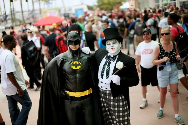 People dressed as a Batman and a Joker pose for pictures outside of the 2015 Comic-Con International in San Diego, California July 10, 2015. (Photo by Sandy Huffaker/Reuters)