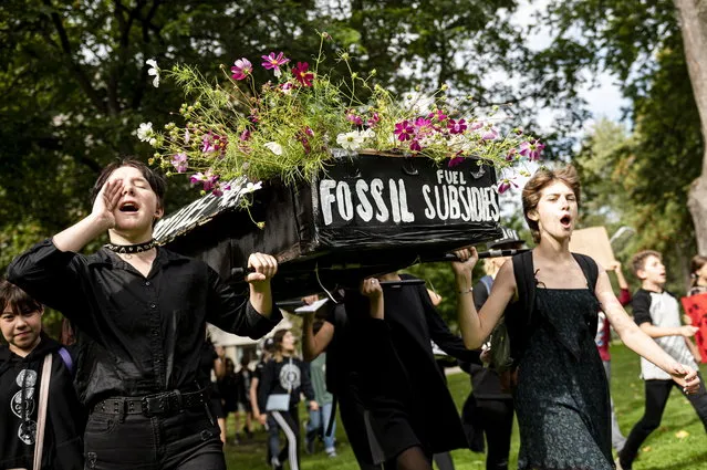 Young people gather at a climate change protest in Toronto on Friday, September 27, 2019. Swedish environmental activist Greta Thunberg, who started the global climate protest movement, pushing thousands of Canadians to the streets today, says she thinks the nasty backlash she has faced from some leaders is proof positive the message is getting across. (Photo by Christopher Katsarov/The Canadian Press via AP Photo)