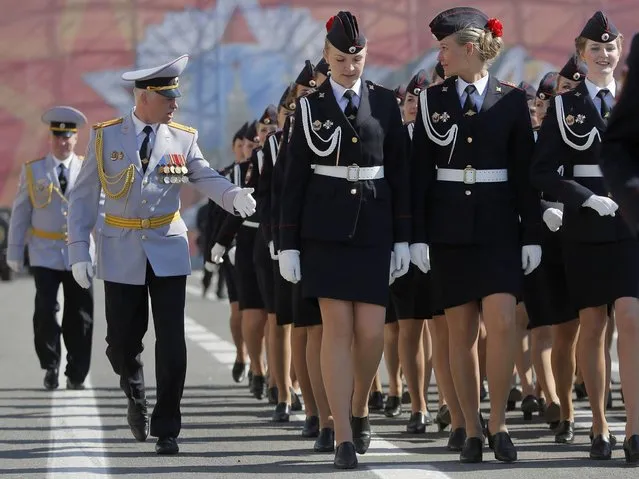 Russian Police academy female cadets march during a rehearsal for the Victory Day military parade at Dvortsovaya (Palace) Square in St Petersburg, Russia, Wednesday, May 7, 2014. Victory Day, marking the defeat of Nazi Germany, is Russia's most important secular holiday celebrated on May 9. (Photo by Dmitry Lovetsky/AP Photo)