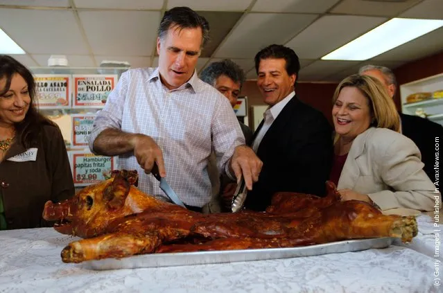 Republican presidential candidate, former Massachusetts Gov. Mitt Romney cuts into a whole roasted pig