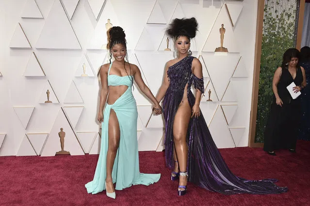 American actresses Halle Bailey, left, and Chloe Bailey arrive at the Oscars on Sunday, March 27, 2022, at the Dolby Theatre in Los Angeles. (Photo by Jordan Strauss/Invision/AP Photo)