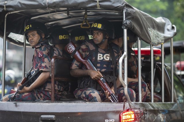 Border Guard Bangladesh (BGB) take position in front of Dhaka College on July 16, 2024, during clashes between anti-quota Protesters and Students supporting the ruling Awami League Party. Rival student groups clashed in Bangladesh, with at least six people killed in three districts including the capital. The clashes were between Chhatra League (the student wing of the Awami league) and quota reform protesters, Demonstrators opposing quotas for government jobs clashed with counter-protesters loyal to the ruling party, according to police. (Photo by Sazzad Hossain/SOPA Images/LightRocket via Getty Images)