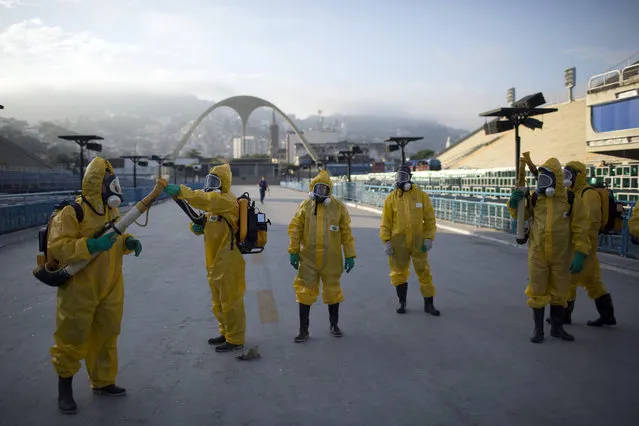 In this Tuesday, Jan. 26, 2016  file photo, health workers get ready to spray insecticide to combat the Aedes aegypti mosquitoes that transmits the Zika virus, under the bleachers of the Sambadrome in Rio de Janeiro, which will be used for the Archery competition in the 2016 summer games. More than 145 public health experts signed an open letter to the World Health Organization on Friday, May 27, 2016 asking the U.N. health agency to consider whether the Rio de Janeiro Olympics should be postponed or moved because of the ongoing Zika outbreak. The letter calls for the games to be delayed or relocated in the name of public health.  (Photo by Leo Correa/AP Photo)