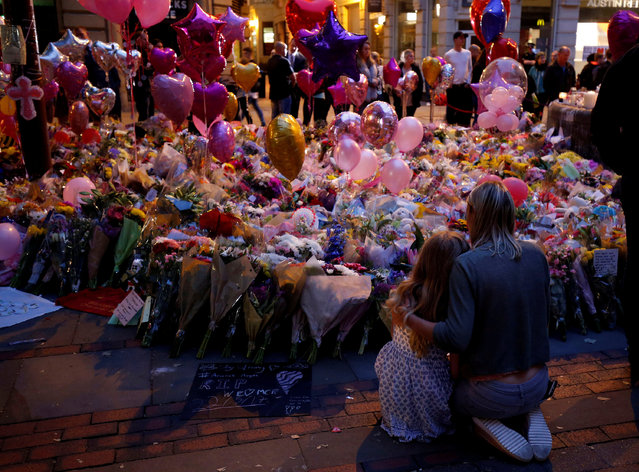 People attend a vigil for the victims of last week's attack at a pop concert at Manchester Arena, in central Manchester, Britain May 29, 2017. (Photo by Andrew Yates/Reuters)