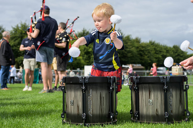 Lewis McKay, two, from East Kilbride, tries out the drums at the 2024 World Pipe Band Championships in Glasgow. on August 16, 2024 Some 204 bands, representing 13 nations and including 9,000 musicians, are competing over two days. (Photo by Wattie Cheung/The Times)