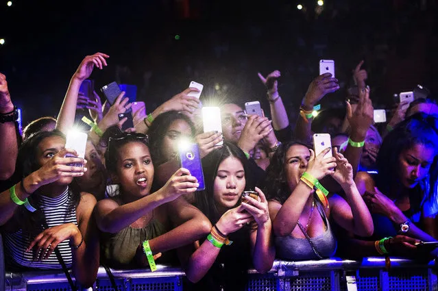 Fans take in a Chris Brown concert with their phones in Stockholm, Sweden on June 03, 2016. (Photo by IBL/Rex Features/Shutterstock)