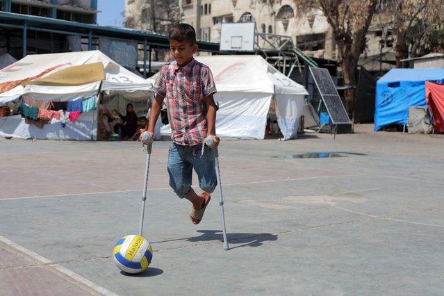 Abdurrahman El-Nashash, who lost a limb, is one of thousands of children who will not be able to attend school this year as Serdi School in Nuseirat Refugee Camp, severely damaged by Israeli attacks, now shelters many displaced Palestinians, on August 22, 2024 in Gaza City, Gaza. (Photo by Hassan Jedi/Anadolu via Getty Images)