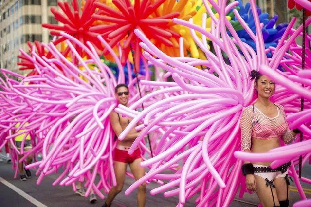 Revellers from SF Balloon Magic march in the San Francisco Gay Pride Festival in California June 29, 2014. (Photo by Noah Berger/Reuters)