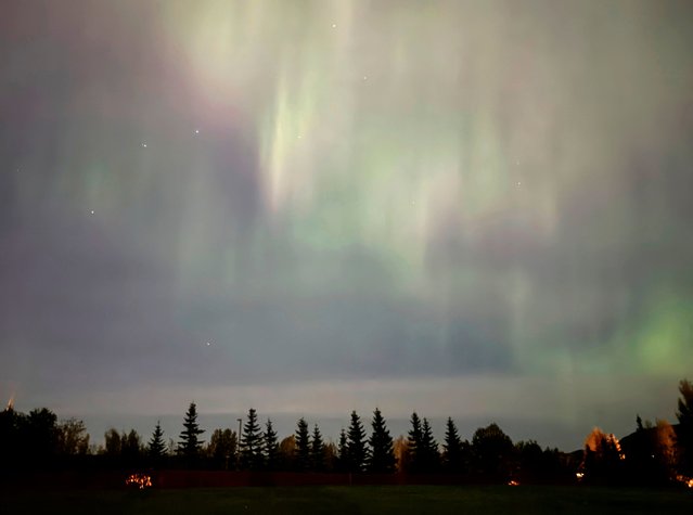 The northern lights illuminate the sky over Anchorage, Alaska, early Tuesday, September 17, 2024. (Photo by Mark Thiessen/AP Photo)