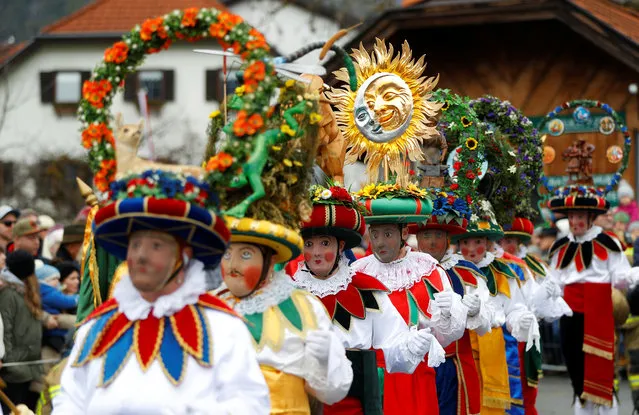 Participants dressed as Schleicher attend the traditional Schleicherlaufen run during Shrovetide (Fasnacht) in Telfs, Austria on February 2, 2020. (Photo by Leonhard Foeger/Reuters)