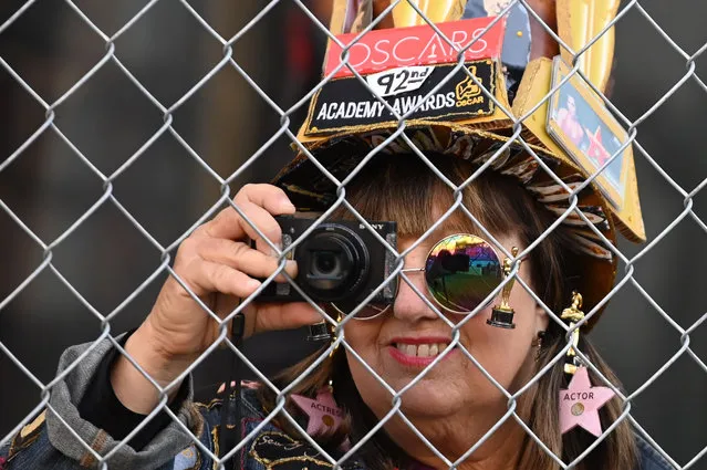 An Oscars fan takes a photo of preparations on the red carpet for the 92nd Annual Oscars on Hollywood Boulevard, February 5, 2020 in Hollywood, California. (Photo by Robyn Beck/AFP Photo)