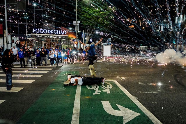 Fireworks go off as fans celebrate on the streets after the Los Angeles Dodgers won against the New York Yankees in the baseball World Series Wednesday, October 30, 2024, in Los Angeles. (Photo by Damian Dovarganes/AP Photo)