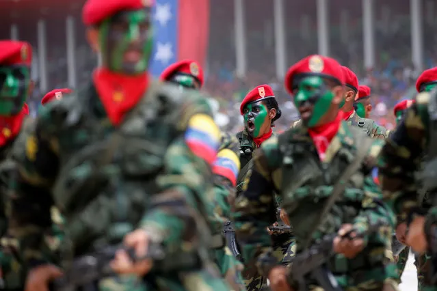 Soldiers with their faces painted march during a military parade to celebrate the 205th anniversary of Venezuela's independence in Caracas, Venezuela July 5, 2016. (Photo by Carlos Jasso/Reuters)