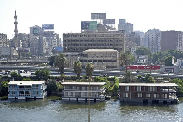 Several houseboats stand moored on the banks of the Nile River in Cairo, Egypt on June 27, 2022. (Photo by Tarek Wagih/AP Photo)