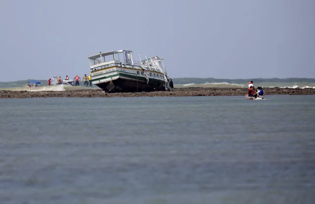 A ferry which capsized on a trip between Ilha de Itaparica island and Salvador city in the coastal state of Bahia, is seen in Ilha de Itaparica island, Brazil, August 25, 2017. (Photo by Ueslei Marcelino/Reuters)