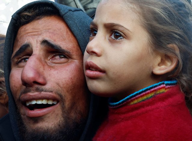 People mourn Palestinians killed in an Israeli strike, at Nasser hospital in Khan Younis in the southern Gaza Strip, on December 5, 2024. (Photo by Mohammed Salem/Reuters)