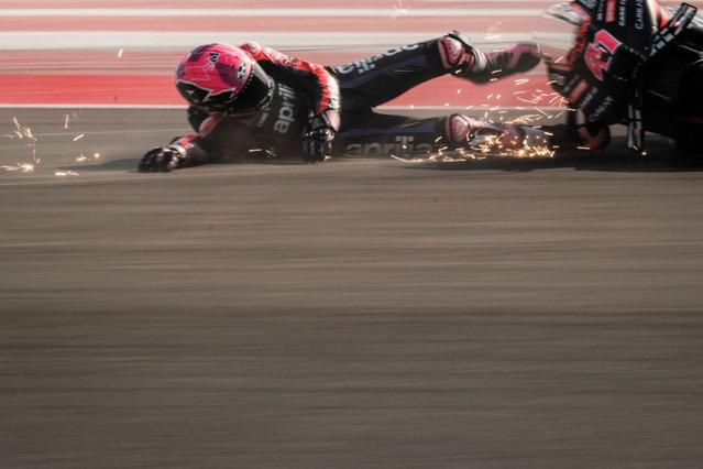 Aprilia Racing's Spanish rider Aleix Espargaro crashes during the free practice session of the Indonesian MotoGP at the Mandalika International Circuit in Kuta Mandalika, Central Lombok, on October 13, 2023. (Photo by Sonny Tumbelaka/AFP Photo)